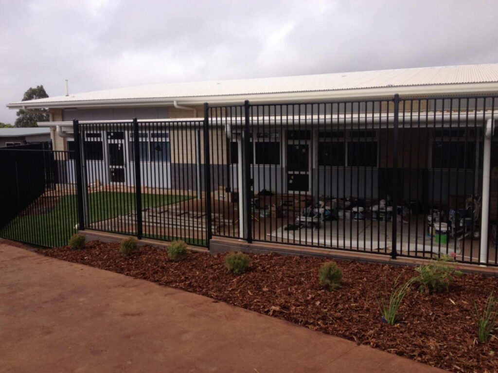 Blace Metal Fence Beside Building